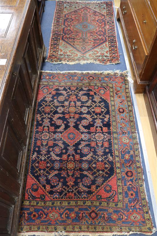 Two small Persian rugs, 122cm x 76cm, 140 x 102cm (both with frayed ends)